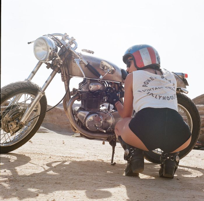 A playful frame from Girls on a motorcycle — online in Seoul
